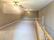 Large bonus room with neutral carpet and a staircase with railing at 323 Wendover Dr, Locust, NC 28097