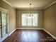 Bright dining room with wood floors and a view of the outdoors at 323 Wendover Dr, Locust, NC 28097