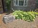 Close up of the address marker showing the house number and attractive landscaping with greenery at 323 Wendover Dr, Locust, NC 28097