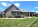 Attractive brick home with a manicured lawn and tasteful landscaping under a sunny sky at 323 Wendover Dr, Locust, NC 28097