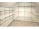 Spacious walk-in closet with custom adjustable shelving, offering ample storage and organization at 323 Wendover Dr, Locust, NC 28097