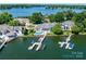 Aerial shot of lakeside homes, docks, and waterfront, showcasing a beautiful community by the water at 3394 Governors Island Dr, Denver, NC 28037