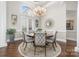 Elegant dining room showcasing a chandelier, round table, and refined decor at 3394 Governors Island Dr, Denver, NC 28037