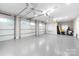 Spacious three car garage with epoxy floors and overhead lighting at 3394 Governors Island Dr, Denver, NC 28037