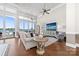 Inviting living room featuring comfortable seating, tv, and expansive water views at 3394 Governors Island Dr, Denver, NC 28037