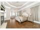 Spacious main bedroom with fireplace, hardwood floors, and a sitting area at 3394 Governors Island Dr, Denver, NC 28037