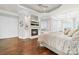 Main bedroom features a fireplace, hardwood floors and ensuite sitting area at 3394 Governors Island Dr, Denver, NC 28037