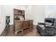 Comfortable office features wood floors and a large dark wood desk with hutch at 3394 Governors Island Dr, Denver, NC 28037