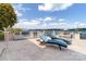 Outdoor patio with built-in grill, waterfront views and comfortable chaise lounges at 3394 Governors Island Dr, Denver, NC 28037
