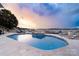 Stunning outdoor pool and hot tub with lake views, offering a relaxing and picturesque setting at 3394 Governors Island Dr, Denver, NC 28037