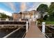 Beautiful rear exterior of home with a large deck and water views at 3394 Governors Island Dr, Denver, NC 28037