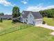 Large fenced backyard with covered deck, two-car garage and green lawn, a peaceful outdoor retreat at 3624 Ramsey Rd, Sharon, SC 29742