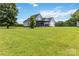 Spacious backyard with lush green grass, a covered patio, and secure fencing, ideal for Gathering enjoyment at 3624 Ramsey Rd, Sharon, SC 29742