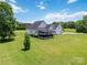 An expansive, green backyard featuring a covered deck, providing a serene outdoor living space at 3624 Ramsey Rd, Sharon, SC 29742