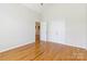 Bedroom featuring hardwood floors, white walls, and a closet with double doors at 3624 Ramsey Rd, Sharon, SC 29742