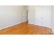 This bedroom has hardwood floors, closet doors and a neutral color scheme at 3624 Ramsey Rd, Sharon, SC 29742