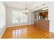 Bright dining room with a chandelier and pass-through to the kitchen at 3624 Ramsey Rd, Sharon, SC 29742