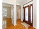 Welcoming foyer featuring hardwood floors and a decorative front door at 3624 Ramsey Rd, Sharon, SC 29742