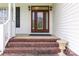 Elegant front entrance with a beautiful glass door and brick steps at 3624 Ramsey Rd, Sharon, SC 29742