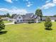 Charming front yard showcases a well-manicured lawn, landscaping, and inviting front porch, creating curb appeal at 3624 Ramsey Rd, Sharon, SC 29742