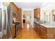 Modern kitchen with stainless steel appliances, granite countertops, and wood cabinets at 3624 Ramsey Rd, Sharon, SC 29742
