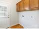 Laundry room offering overhead cabinets, hardwood floors and easy access to outside at 3624 Ramsey Rd, Sharon, SC 29742