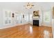 Bright living room with hardwood floors, fireplace, and multiple windows at 3624 Ramsey Rd, Sharon, SC 29742