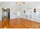 Spacious living room with hardwood floors, ceiling fan, and lots of natural light at 3624 Ramsey Rd, Sharon, SC 29742