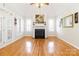 Spacious living room with fireplace, bright windows, and hardwood flooring at 3624 Ramsey Rd, Sharon, SC 29742
