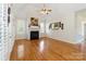 Comfortable living room with vaulted ceiling, fireplace, and large windows at 3624 Ramsey Rd, Sharon, SC 29742
