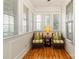 Comfortable sunroom featuring wicker chairs and a decorative table with a lamp at 3624 Ramsey Rd, Sharon, SC 29742