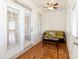 Cozy sunroom featuring beautiful wood flooring, a ceiling fan, and comfortable seating for enjoying natural light and relaxation at 3624 Ramsey Rd, Sharon, SC 29742