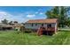 Spacious backyard with a well-maintained lawn, a cozy deck, and mature trees at 3651 16Th Ne St, Hickory, NC 28601