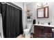 Cozy bathroom featuring a modern vanity, a toilet, and a shower with a patterned curtain, offering a functional space at 3651 16Th Ne St, Hickory, NC 28601