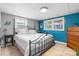 Cozy bedroom with natural light, neutral decor and decorative iron frame bed at 3651 16Th Ne St, Hickory, NC 28601