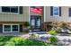 Inviting home entrance with American flag, seasonal decor, and lush landscaping at 3651 16Th Ne St, Hickory, NC 28601