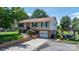 Attractive home with a well-kept lawn, a paved driveway, and an inviting outdoor gathering spot at 3651 16Th Ne St, Hickory, NC 28601