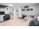 Comfortable living room space with work station and desk with a neutral color palette at 3651 16Th Ne St, Hickory, NC 28601
