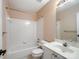 Well-lit bathroom with a combination tub and shower, plus a vanity and toilet at 3720 Winterberry Nw Ct, Concord, NC 28027