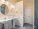 Bathroom boasts dual vanities, stylish fixtures, and plenty of counter space for a luxurious feel at 3720 Winterberry Nw Ct, Concord, NC 28027