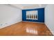 This primary bedroom offers recessed lighting, hardwood floors, and a beautiful accent wall at 3720 Winterberry Nw Ct, Concord, NC 28027