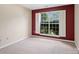 Bedroom featuring a large window offering plenty of natural light and a calming view at 3720 Winterberry Nw Ct, Concord, NC 28027