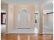 Bright foyer featuring tile flooring, a white door, and views into other rooms at 3720 Winterberry Nw Ct, Concord, NC 28027