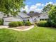 Charming one-story home with manicured lawn and lush landscaping in a suburban neighborhood at 3720 Winterberry Nw Ct, Concord, NC 28027
