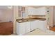 The kitchen has a double sink, white dishwasher, and plenty of upper and lower cabinet storage at 3720 Winterberry Nw Ct, Concord, NC 28027