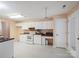 Bright kitchen with white cabinetry, modern appliances, and neutral countertops offering plenty of space at 3720 Winterberry Nw Ct, Concord, NC 28027
