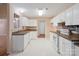 Well-lit kitchen featuring white cabinets, neutral countertops, and a practical layout for cooking at 3720 Winterberry Nw Ct, Concord, NC 28027