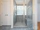 Walk-in shower with glass enclosure and tile surround showcasing both style and function at 3720 Winterberry Nw Ct, Concord, NC 28027