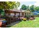 Back deck with gazebo overlooking manicured lawn and garden at 3889 Mattingly Dr, Hickory, NC 28602