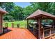 Expansive backyard showcasing the deck, gazebo, and lush lawn, perfect for outdoor activities and relaxation at 3889 Mattingly Dr, Hickory, NC 28602
